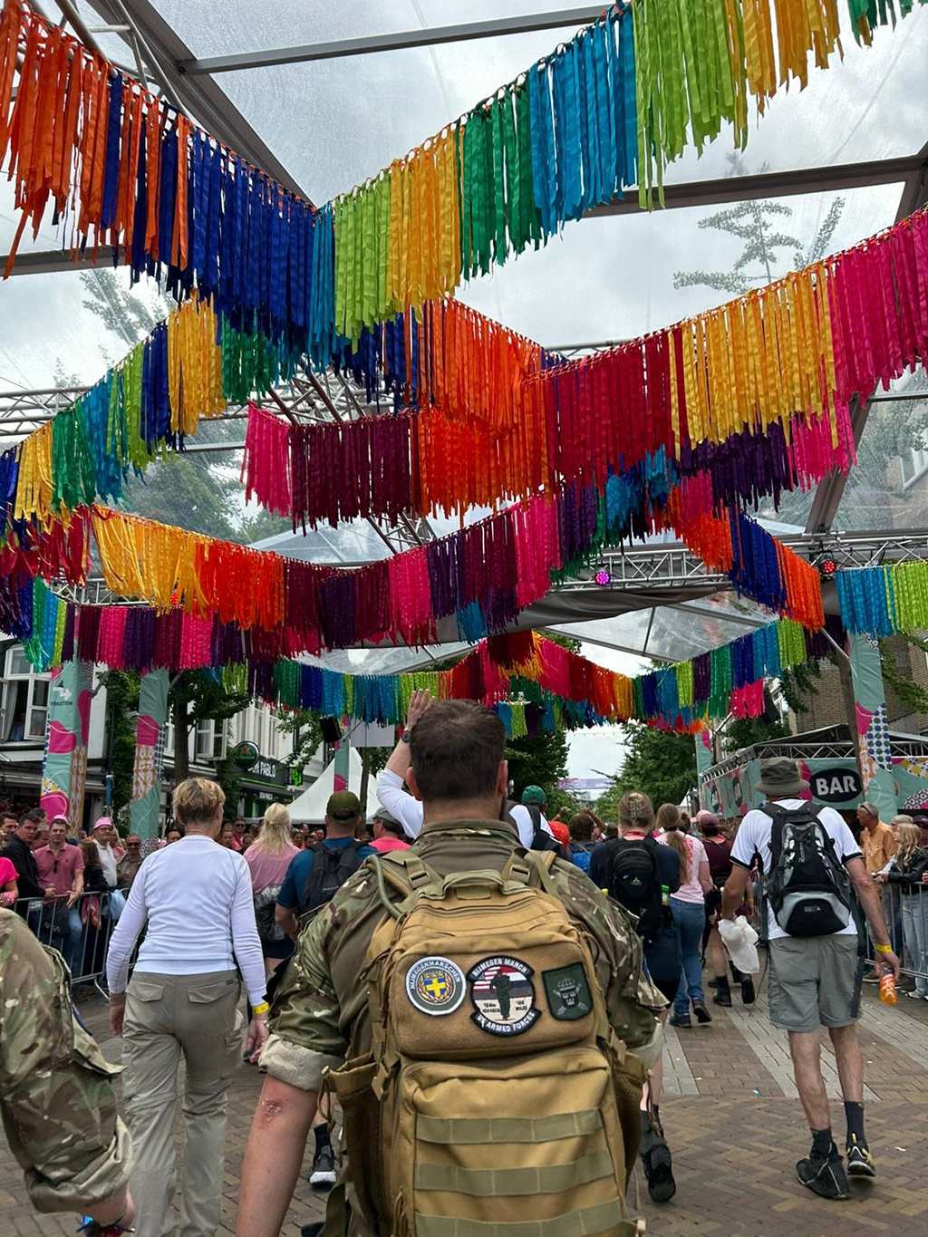 POV | The team following other walkers through town streets.